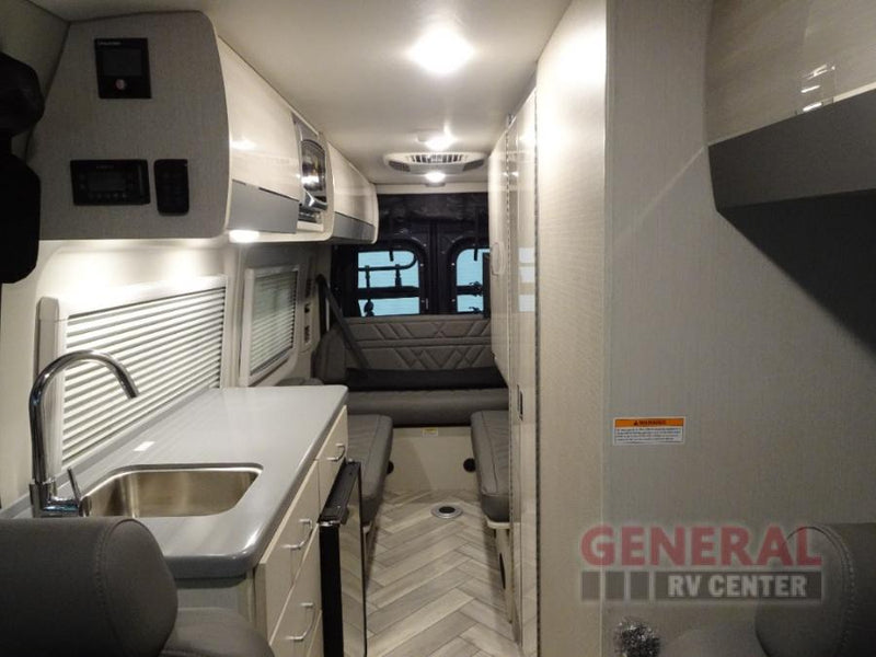  ready for your next adventure.|View the functional interior of an RV rental: a compact kitchen area with sink — photo 5