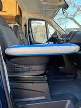 RV rental interior with a blue & white inflatable float on the passenger seat, ready for adventure.