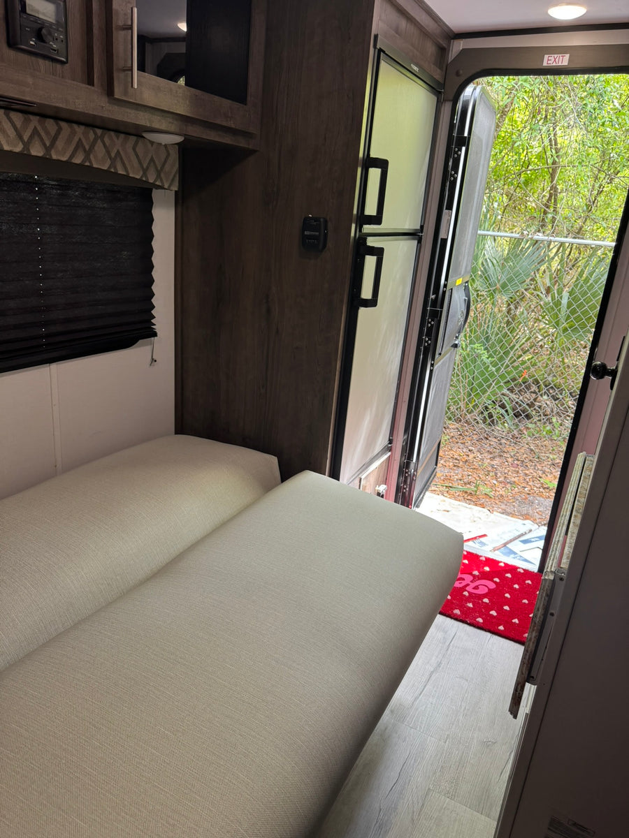  ready for outdoor travel.|Inside an RV rental: light gray seating