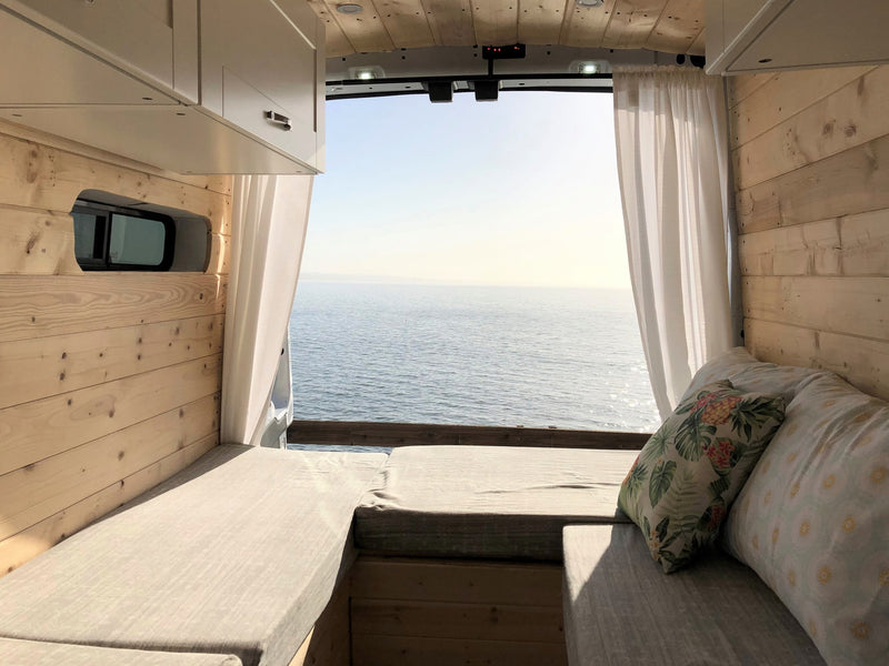  looking out at the blue sea.|White camper van (RV rental) by San Francisco's iconic Golden Gate Bridge — photo 13