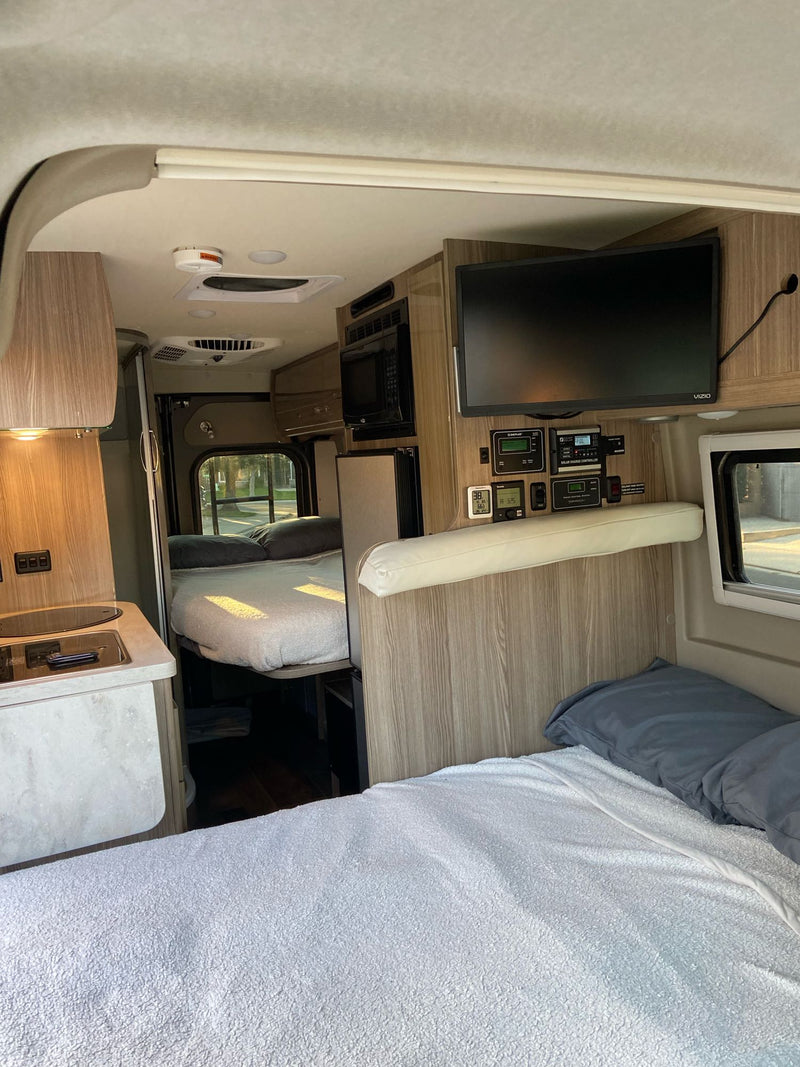  inviting interior.|Spacious RV rental interior featuring comfortable seating — photo 6