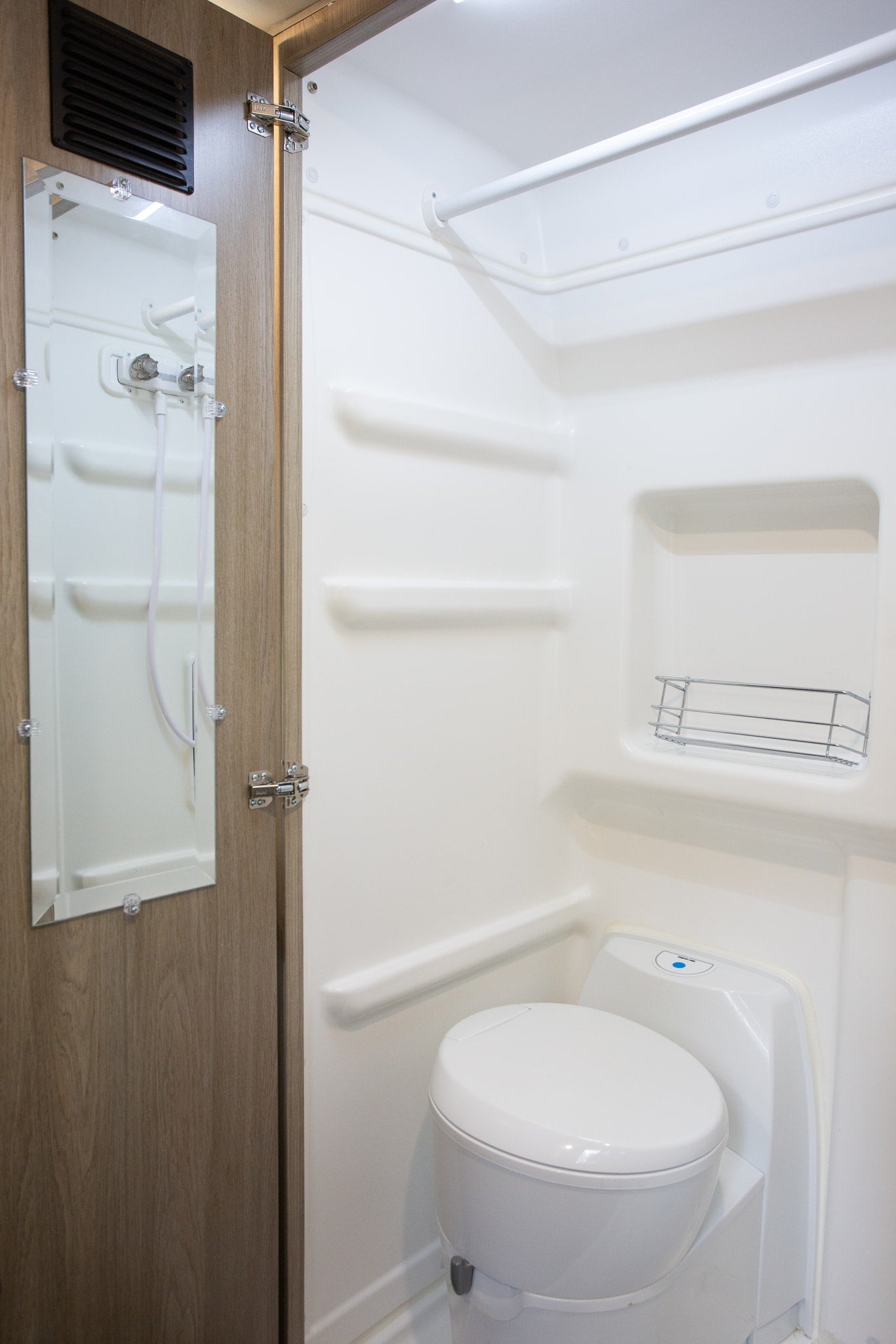  and wall-mounted controls.|Cozy RV rental pop-top interior. View from the sleeping platform — photo 20