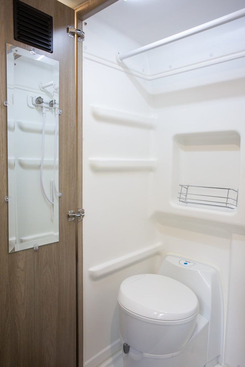  and wall-mounted controls.|Cozy RV rental pop-top interior. View from the sleeping platform — photo 20