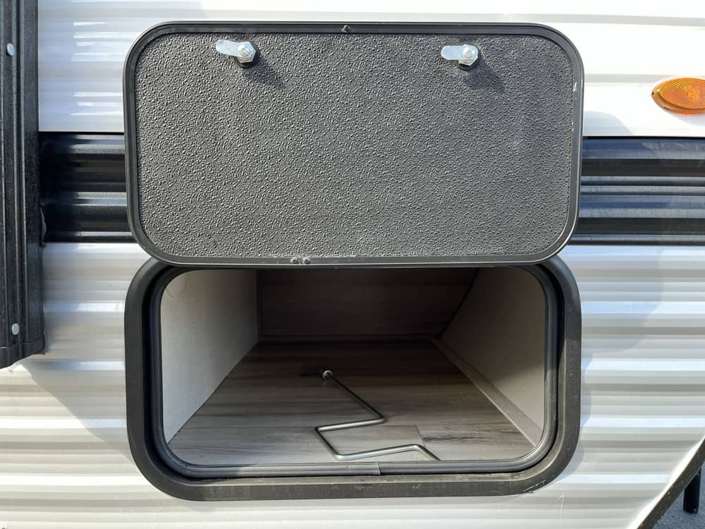 is ready for outdoor adventure.|A small white Coleman travel trailer for rv rental — photo 4