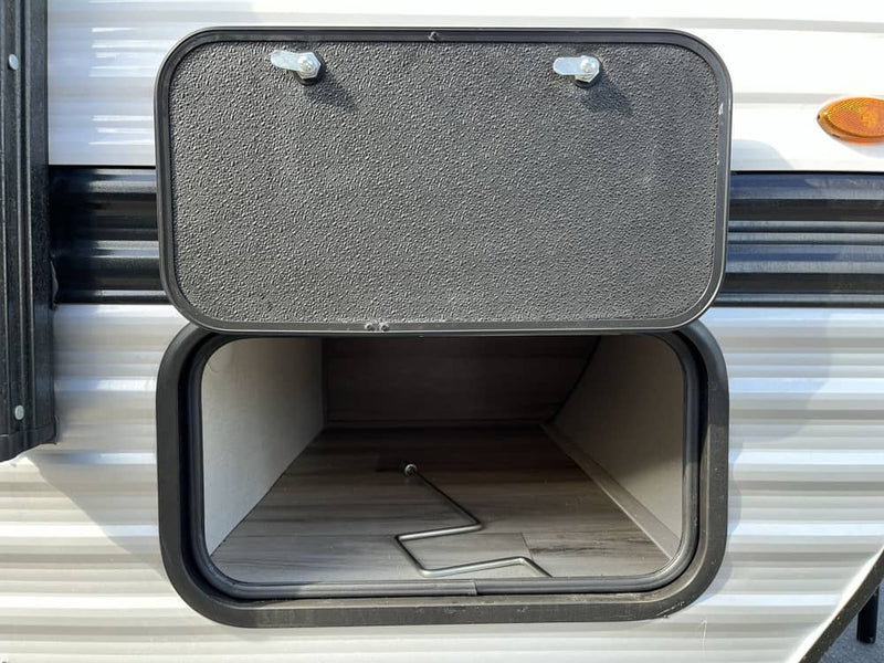  is ready for outdoor adventure.|A small white Coleman travel trailer for rv rental — photo 4