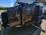 This rugged Off Grid Expedition 2.0 trailer, black with map graphics, is an excellent rv rental for overlanding.