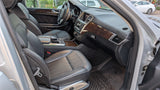 Inside a modern car: premium black leather seats, wood trim, and detailed dashboard. A comfortable option beyond typical RV rental.
