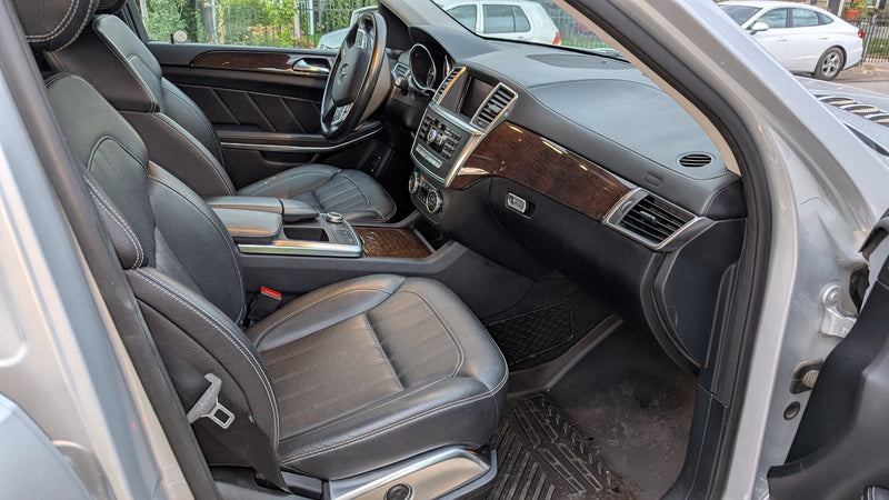 Inside a modern car: premium black leather seats, wood trim, and detailed dashboard. A comfortable option beyond typical RV rental. — photo 15