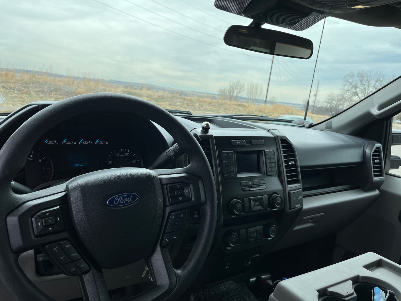 Ford truck interior: dashboard and steering wheel. Perfect for towing your RV rental or hauling gear for your next adventure.
