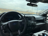 Ford truck interior: dashboard and steering wheel. Perfect for towing your RV rental or hauling gear for your next adventure.