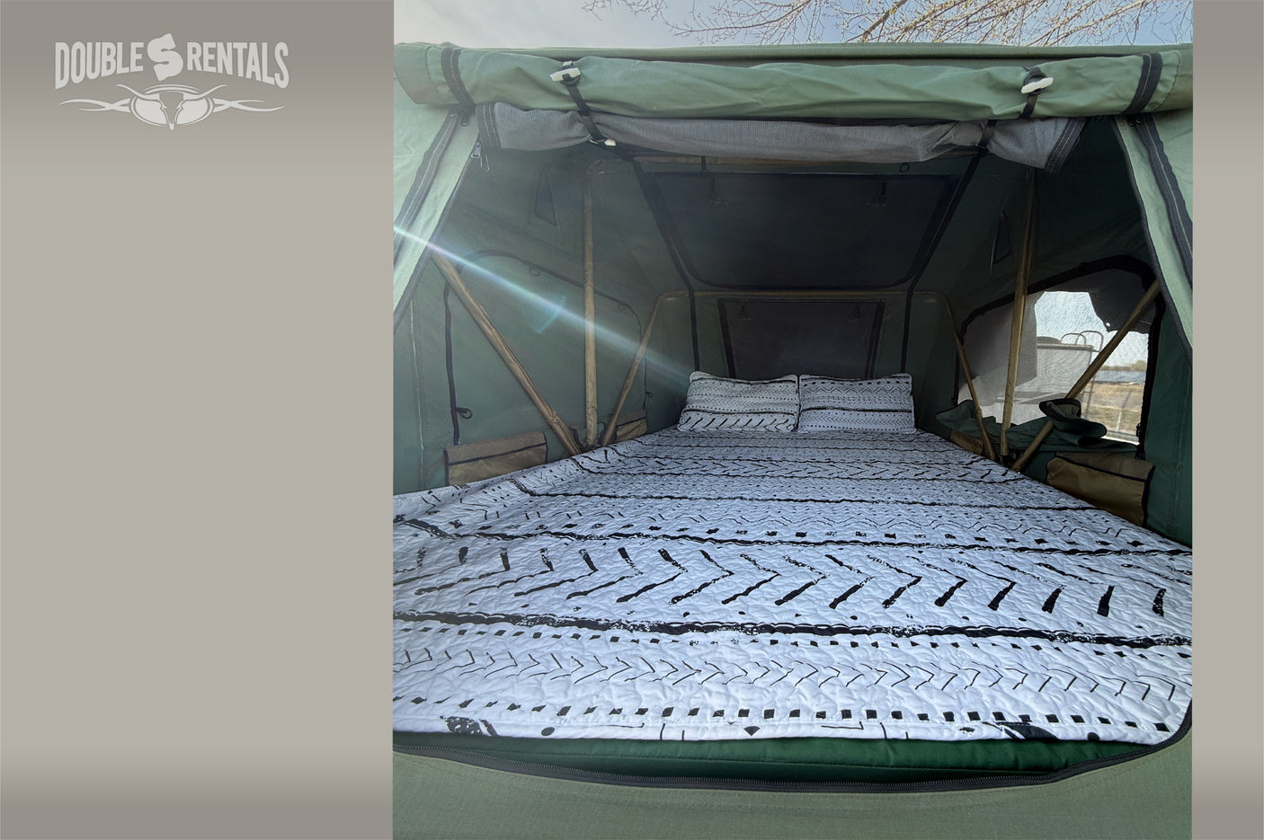 Inside this cozy RV rental rooftop tent, a comfy bed awaits your adventure. Enjoy camping with Double S Rentals!