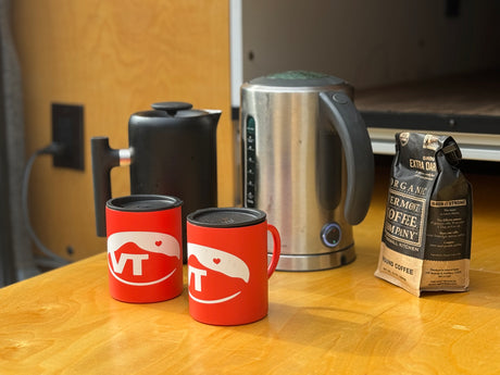 Perfect coffee morning in your RV rental! Two VT mugs, kettles, and Vermont Coffee Co. grounds ready for brewing.