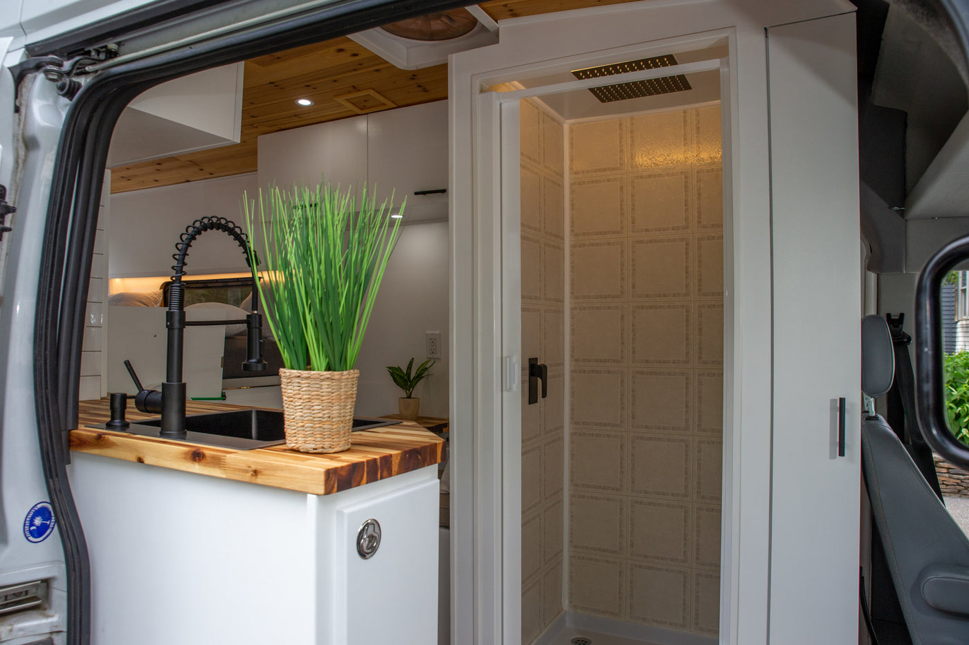 Ultimate Adventure Van with AC & Hot Shower, Battery bank, Queen Bed — photo 12