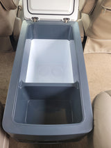 Open RV rental cooler/fridge with two compartments, including cup holders for beverages on your journey.