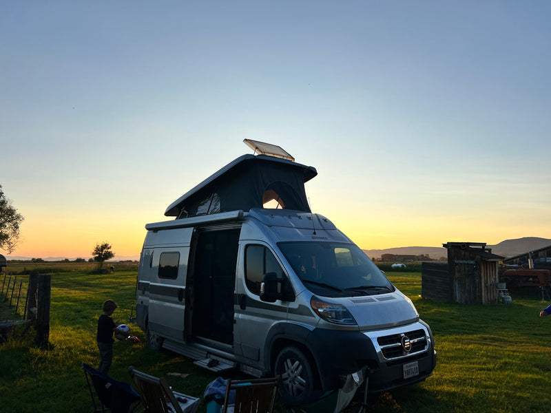  and gifts in a desert setting.|RV rental camper van in a forest on a dirt road — photo 7