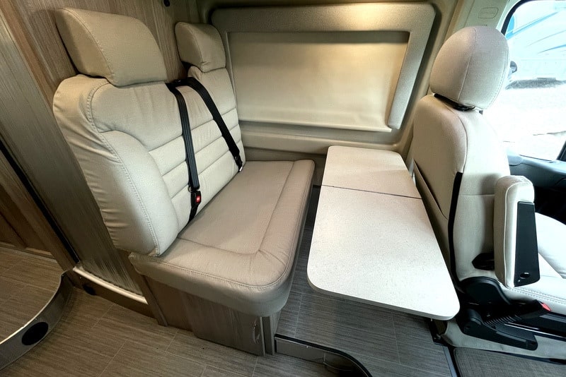  and large central display. Ready for adventure!|Compact RV rental interior featuring a wet bath with toilet and shower — photo 7