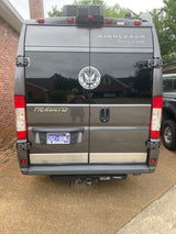 Rear view of a grey Winnebago Travato camper van, featuring a TN license plate and U.S. Navy decal, ideal for an rv rental.