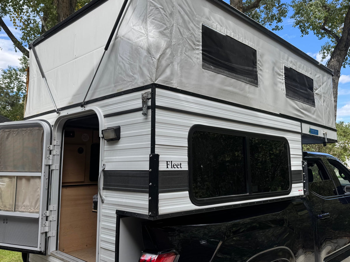  with its roof extended & door open revealing a glimpse of the interior — photo 8