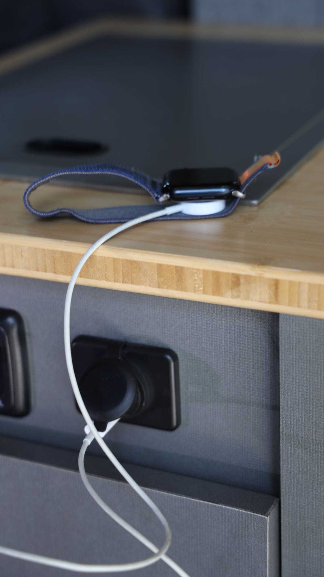 Charging an Apple Watch in an RV rental.