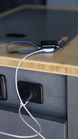 Charging an Apple Watch in an RV rental.