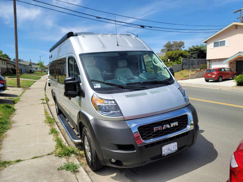 Silver Ram ProMaster RV rental van on a sunny residential street, ready for adventure. — photo 2