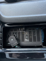 Onboard power convenience in an RV rental: A power inverter with AC outlets & USB ports provides essential charging.