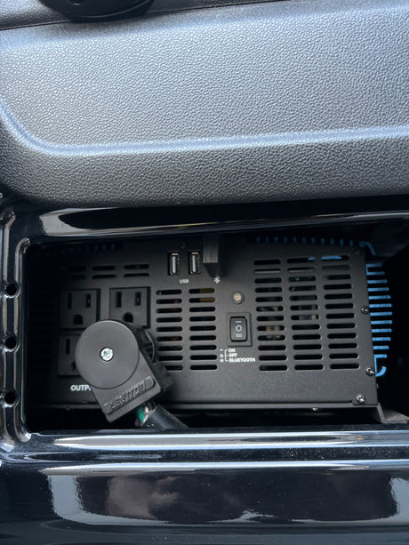 Onboard power convenience in an RV rental: A power inverter with AC outlets & USB ports provides essential charging.