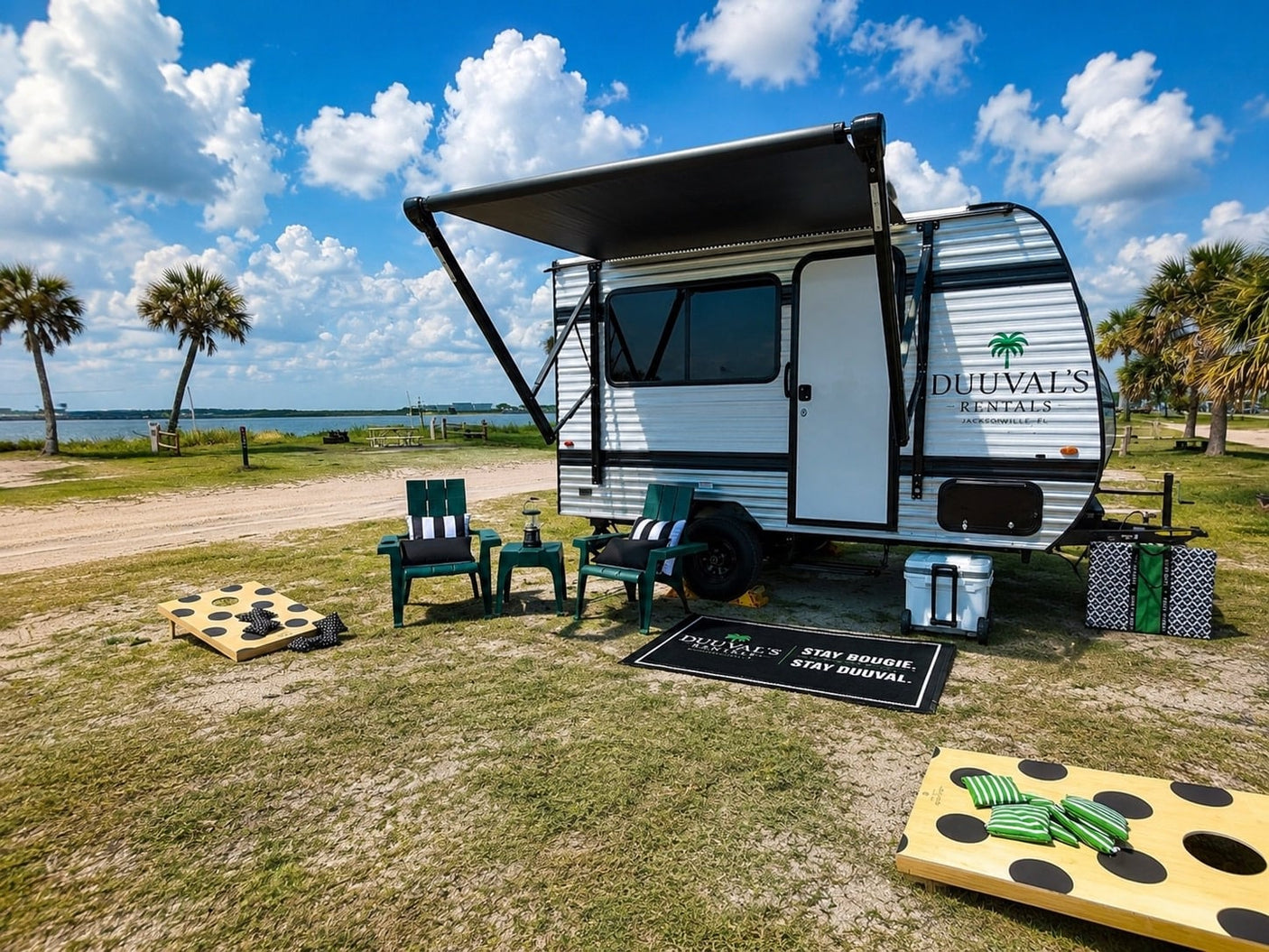 Experience this Duuval's RV rental setup: a travel trailer by the water