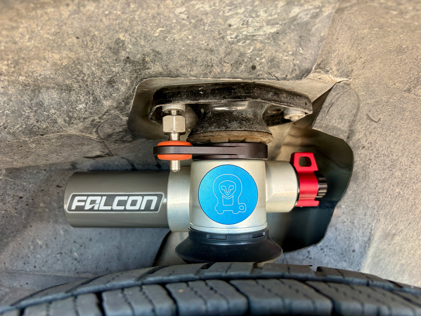 RV rental suspension: A Falcon shock absorber and tire are visible inside the wheel well, showing robust travel features.