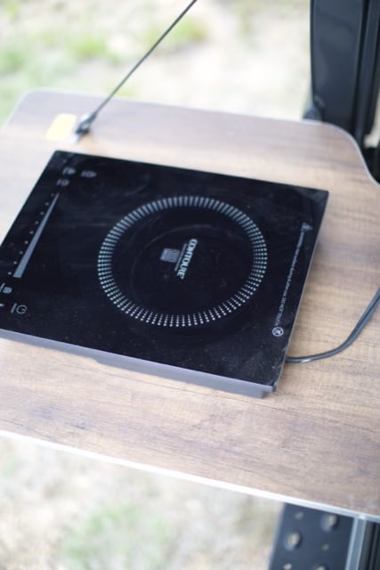  featuring a cozy bed & ample storage. Perfect for your next adventure.|This RV rental's water control panel shows settings for fresh water — photo 15