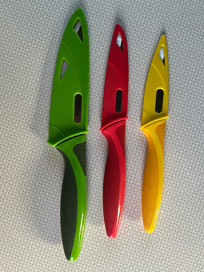 Three vibrant green, red, and yellow kitchen knives displayed. Great for cooking at home or on your next RV rental adventure! — photo 10