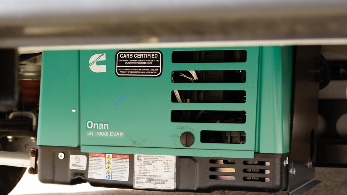 This Cummins Onan QG 2800i EVAP generator, essential for an RV rental, provides reliable portable power.