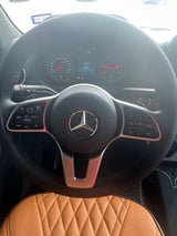 Detailed Mercedes-Benz vehicle interior, possibly an RV rental, showing steering wheel, digital dashboard, and 2809 miles.