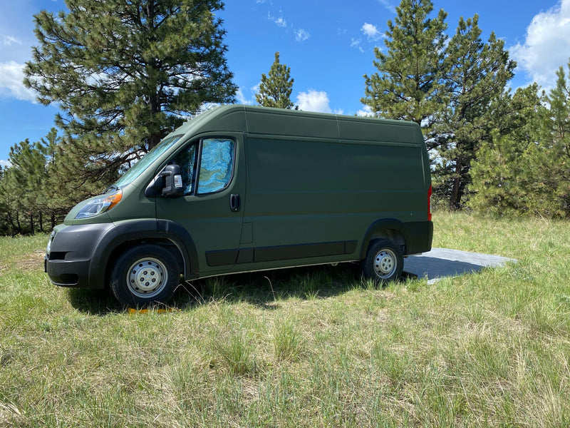  and cups. Ready for adventures!|Inside this cozy RV rental: a comfortable bed with ambient blue lighting and a compact kitchen area.|This cozy rv rental van features a comfy bed — photo 9