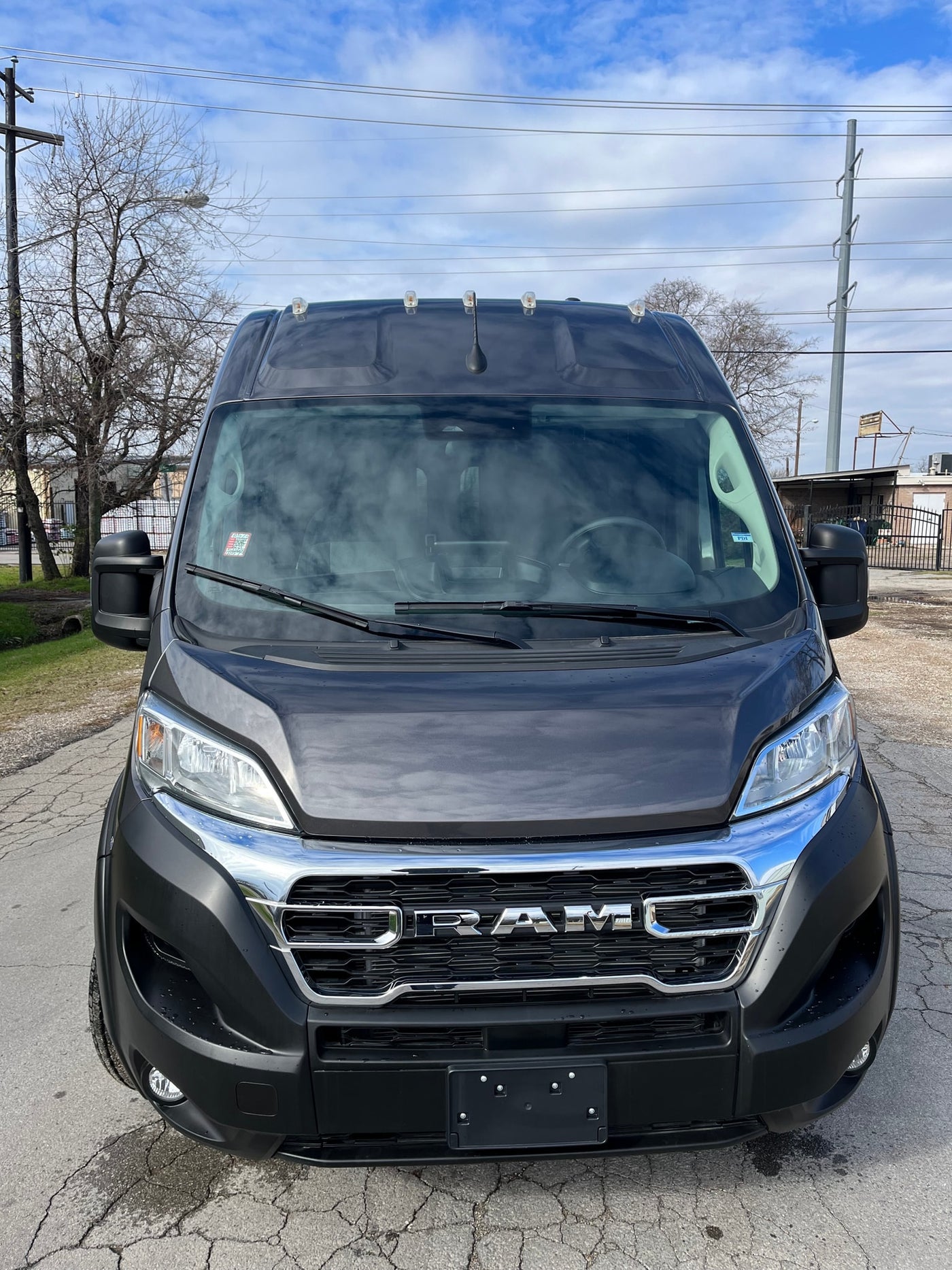 Front view of a dark gray RAM ProMaster van, ideal for your next rv rental adventure. — photo 5