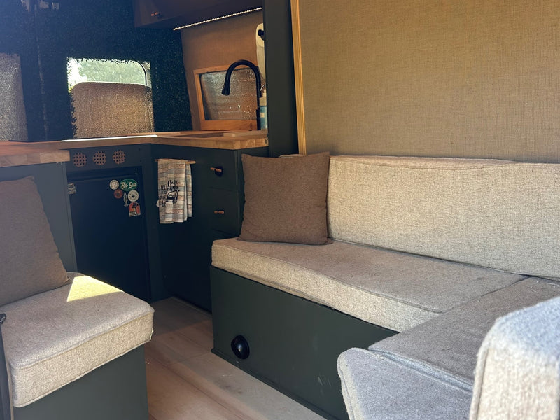  and a compact kitchen. Your next adventure.|RV rental van interior: cozy bed — photo 5