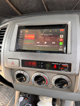 An RV rental dashboard shows a JVC stereo playing The Band, climate controls, and the time 2:38.