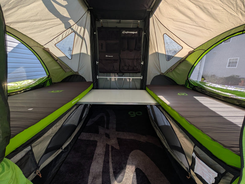  features a mesh window and storage inside. Ideal for camping.|Cozy interior of a Sylvansport RV rental pop-up tent — photo 16