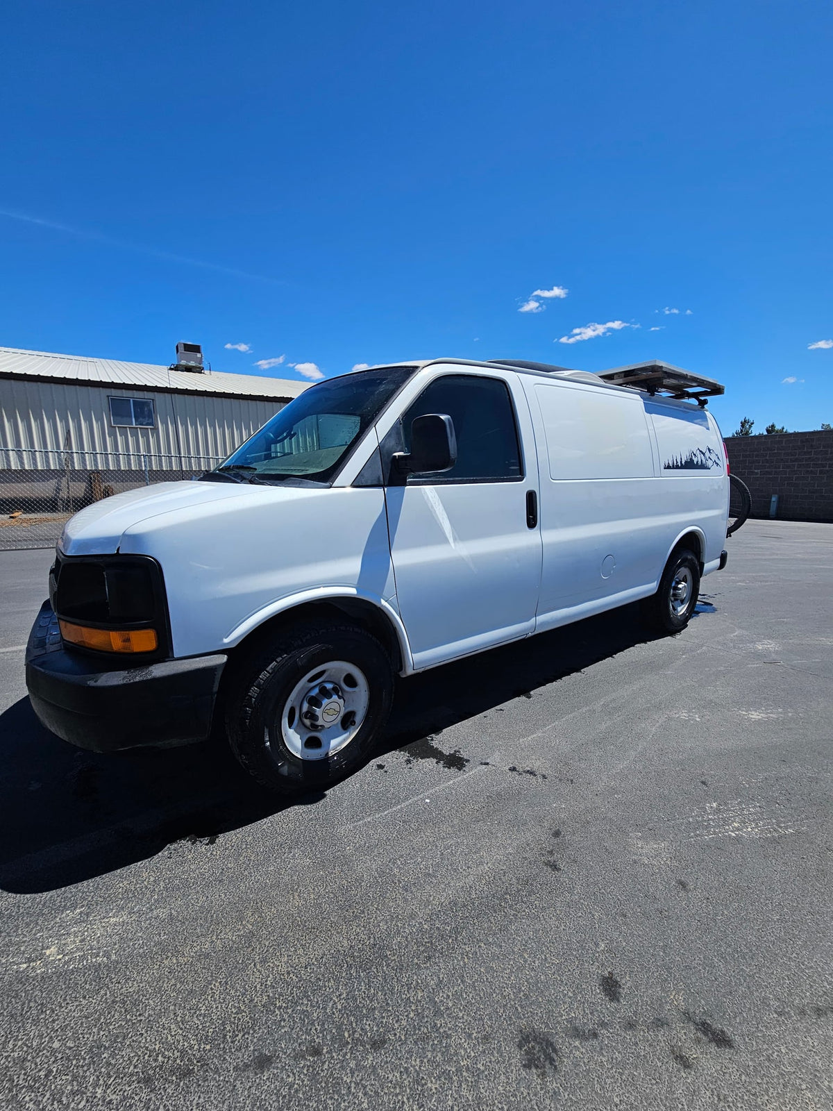  and a privacy curtain.|RV rental van interior: Chevrolet steering wheel — photo 14