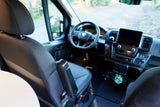 Interior of an **rv rental** showing the cockpit from the passenger seat, featuring the dashboard, steering wheel, and screen.