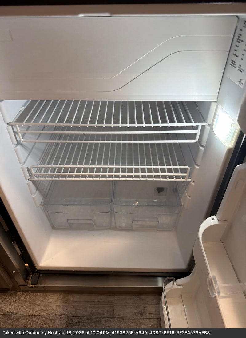  and a removable dining table.|Bright RV rental interior showcasing a large skylight — photo 10