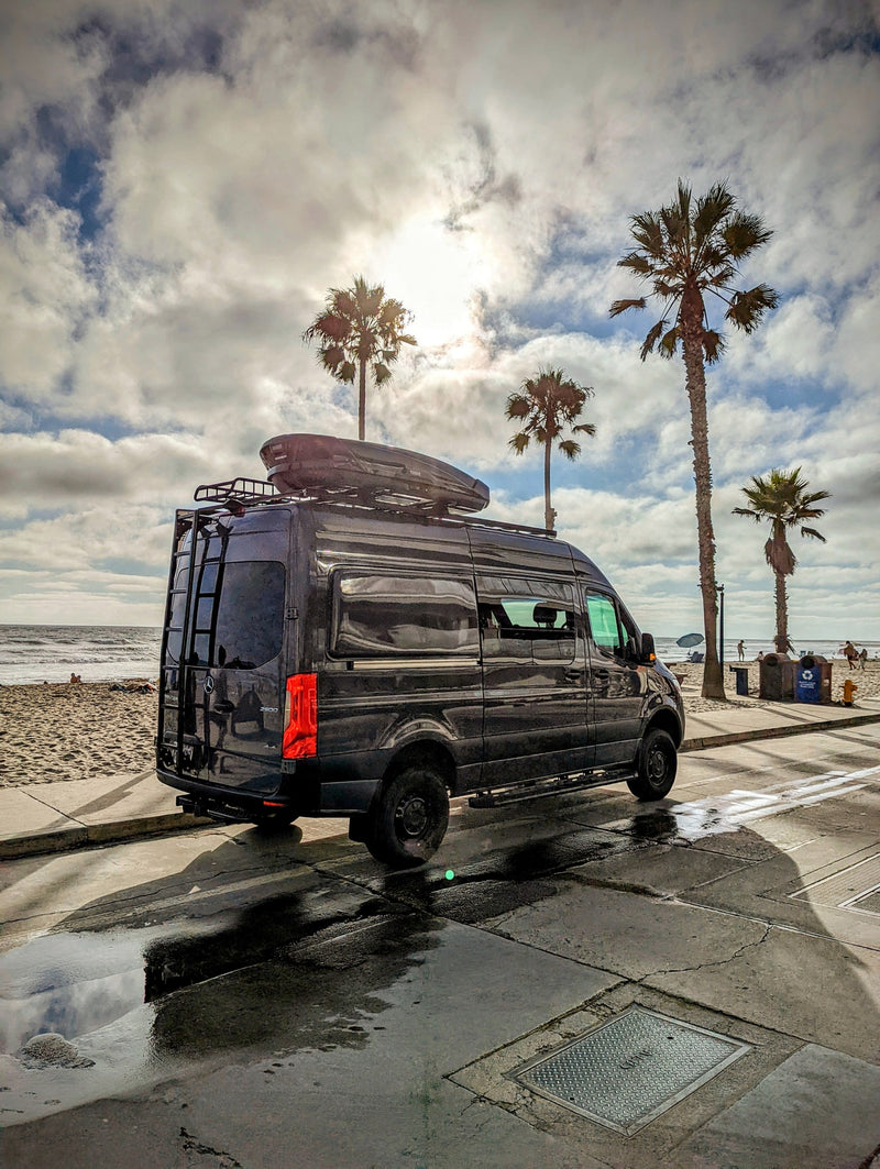  ready for adventure. Ideal for RV rental with its off-road tires & roof rack.|Spacious RV rental interior with multiple rows of passenger seats — photo 4