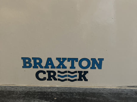 Braxton Creek RV rental logo in blue, featuring wavy lines within the 'Creek' text.