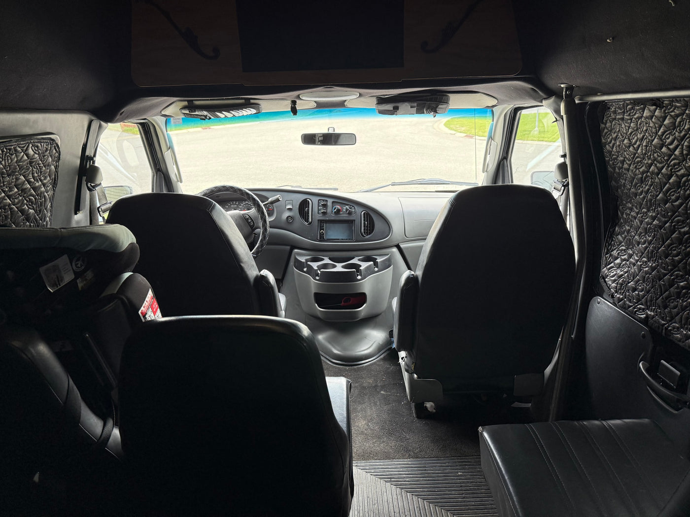  parked in a residential driveway.|Light blue high-top Ford van — photo 4