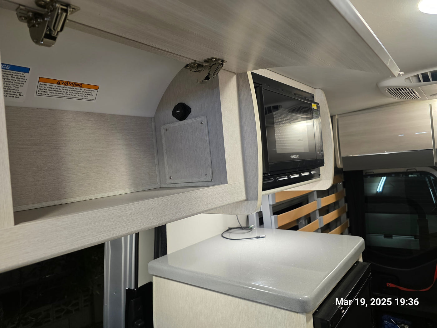  perfect for an RV rental. Organized gear inside for adventure trips.|RV rental interior: light wood kitchenette — photo 14