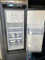 Clean, empty RV rental refrigerator interior with shelves and door bins, ready for your next adventure.