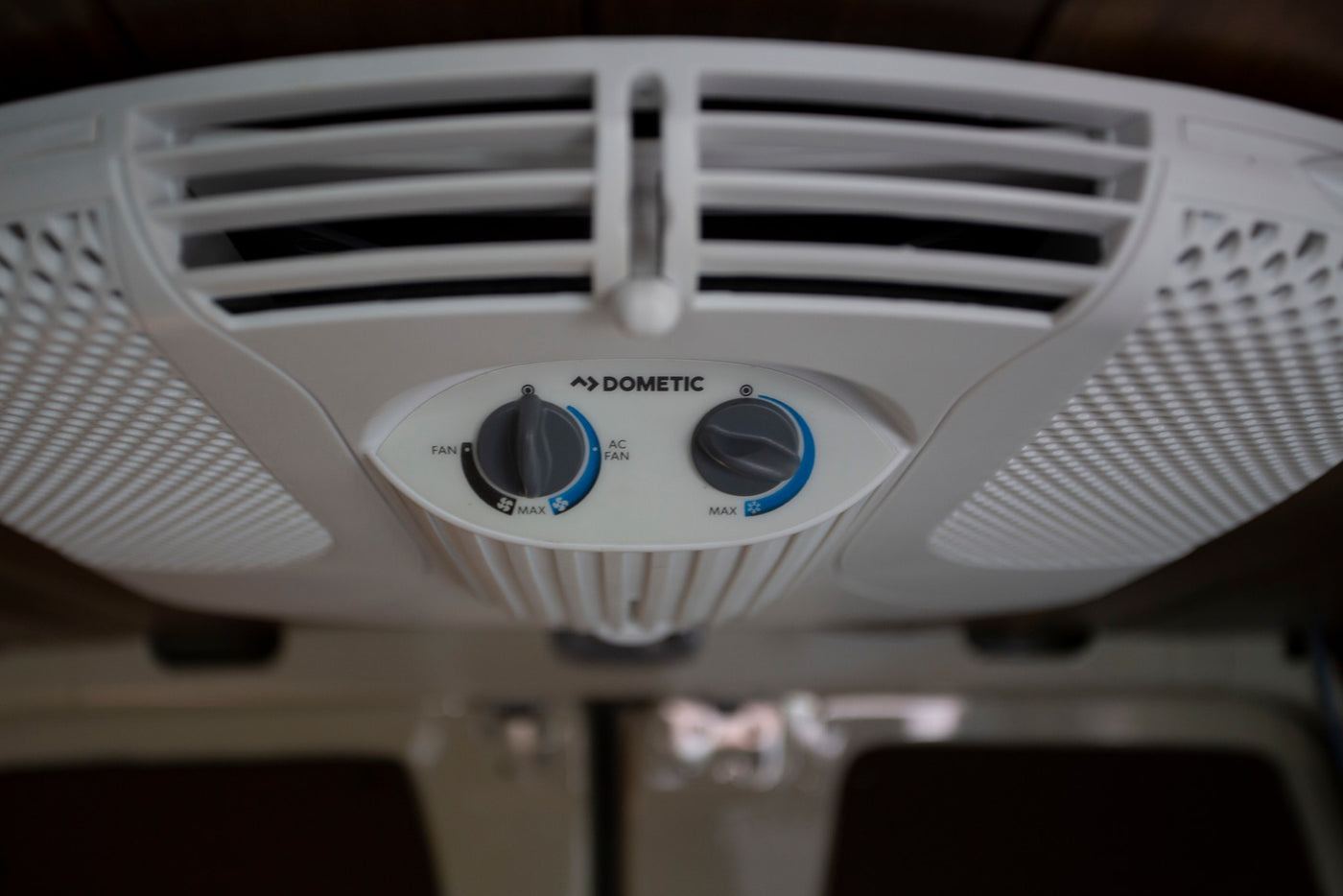 Enjoy cool comfort in your rv rental with this Dometic ceiling AC unit's fan and cooling controls. Perfect for camping! — photo 15
