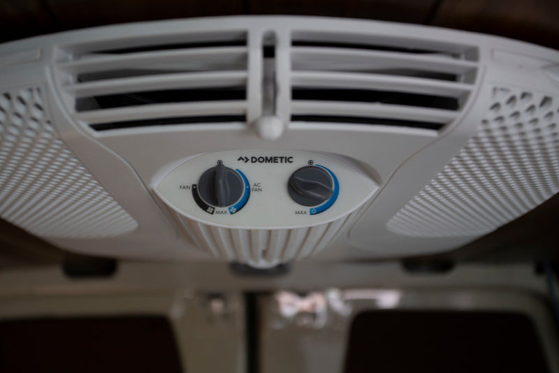 Enjoy cool comfort in your rv rental with this Dometic ceiling AC unit's fan and cooling controls. Perfect for camping! — photo 15