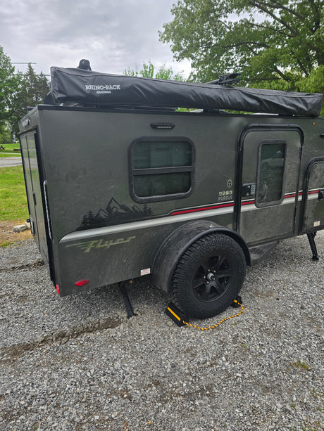 This rugged, dark gray Teardrop RV rental is ready for off-road camping and outdoor exploration.
