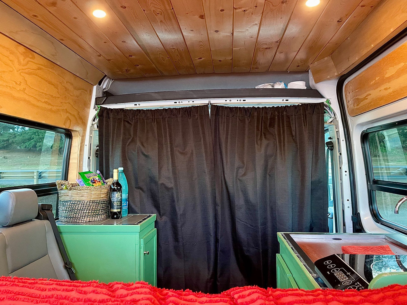  and an open built-in refrigerator with blue shelves.|Inside an RV rental — photo 14